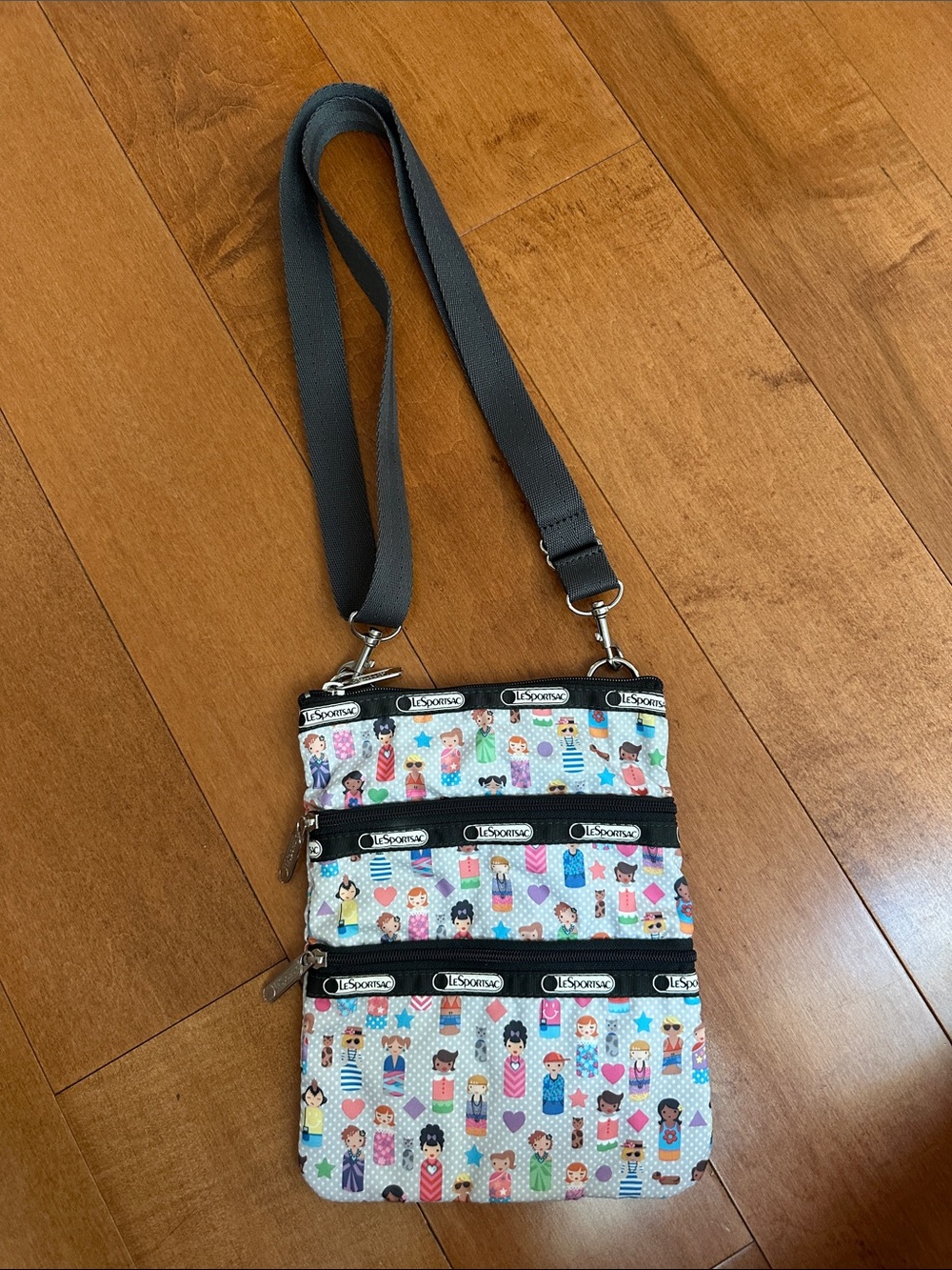 LeSportsac Crossbody Bag with Multicolor Doll Print and Gray Strap